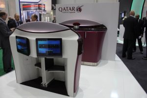 AIRCRAFT INTERIORS - Qatar 787 bar complex showing rear of magazine rack, revealing inflight entertainment